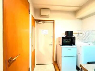 a small kitchen with a refrigerator and a microwave at Amika First 202 AF22 in Tokyo