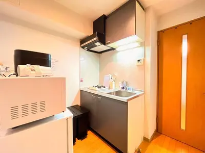 a small kitchen with a sink and a refrigerator at Amika First 202 AF22 in Tokyo