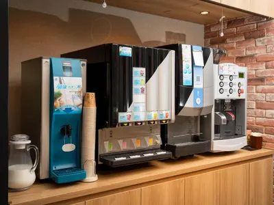 a coffee machine sitting on top of a counter at Super Hotel Shinbashi-Karasumoriguchi in Tokyo