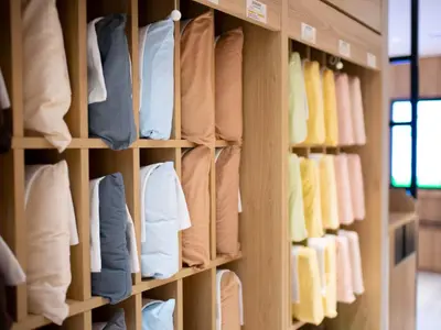 a room filled with shelves filled with towels at Super Hotel Shinbashi-Karasumoriguchi in Tokyo