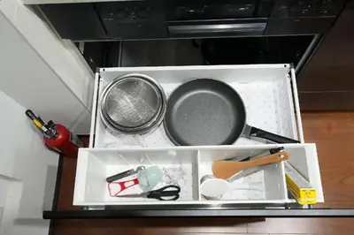 a drawer filled with pots and pans on a table at 100 INN Suite in Tokyo