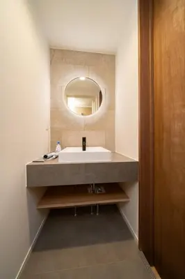 a bathroom with a sink and a mirror at Vacation house rental Matsu kaze tei Tokyo in Tokyo