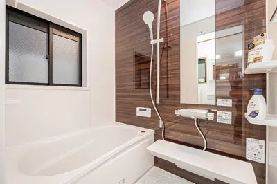 a bathroom with a bath tub and a sink at Tokyo Stay House Hirai in Tokyo