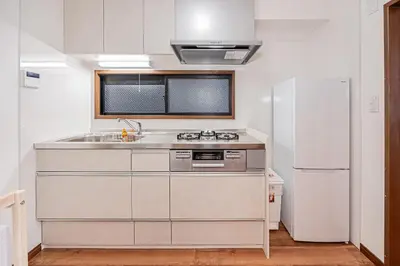 a kitchen with a sink and a refrigerator at Tokyo Stay House Hirai in Tokyo