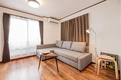 a living room with a couch and a table at Tokyo Stay House Hirai in Tokyo