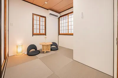 a room with two chairs and a table at Tokyo Stay House Hirai in Tokyo