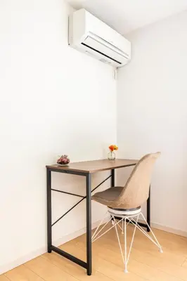 a desk and a chair in a room at Cozy Stay Kanamecho in Tokyo