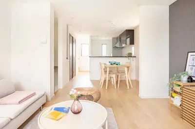 a living room with a couch and a table at Cozy Stay Kanamecho in Tokyo