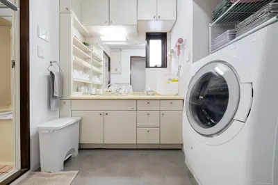 a white laundry room with a washing machine at Apartment hotel 3 minutes walk from JR Asagaya station Ideal base for exploring Tokyo HOTEL CtrlD ASAGAYA in Tokyo