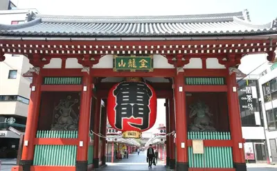 a pagoda with a sign on the front of a building at tkm\u5317\u5c0f\u5ca91\u4e01\u76ee202 in Tokyo