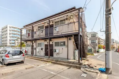 a building that is under construction on a street at tkm\u5317\u5c0f\u5ca91\u4e01\u76ee202 in Tokyo