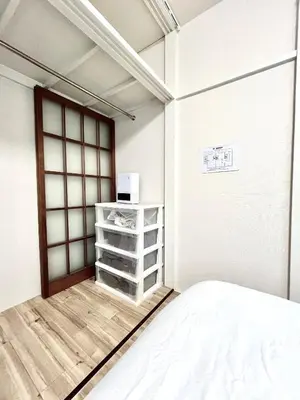 a white room with a bed and a window at tkm\u5317\u5c0f\u5ca91\u4e01\u76ee203 in Tokyo