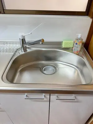 a stainless steel sink in a small kitchen at Style Lab\u56db\u3064\u6728 in Tokyo