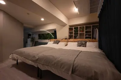 a bedroom with a large bed with white pillows at 8Minutes Walk to IkebukuroStation, CentralTokyo and VeryConvenient Max5People in Tokyo