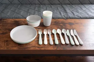 a table with white utensils and plates and cups at 8Minutes Walk to IkebukuroStation, CentralTokyo and VeryConvenient Max5People in Tokyo