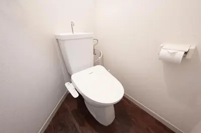 a white toilet in a bathroom with a roll of toilet paper at 8Minutes Walk to IkebukuroStation, CentralTokyo and VeryConvenient Max5People in Tokyo
