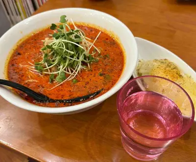 a bowl of soup on a table next to a glass at 8Minutes Walk to IkebukuroStation, CentralTokyo and VeryConvenient Max5People in Tokyo