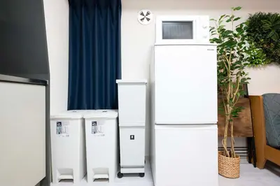 two refrigerators sitting next to each other in a room at 8Minutes Walk to IkebukuroStation, CentralTokyo and VeryConvenient Max5People in Tokyo