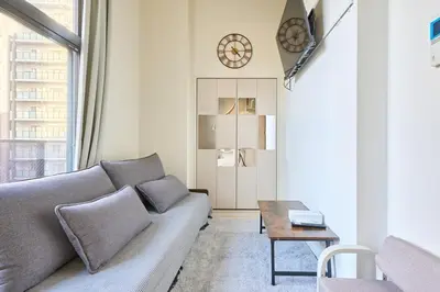 a living room with a couch and a table at N 5min to waseda sta designer condo high security free wifi in Tokyo