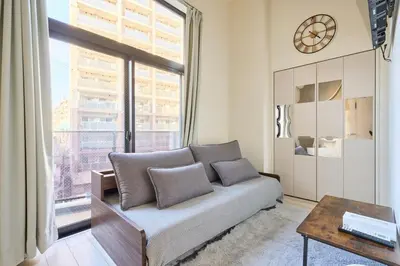 a living room with a couch and a large window at N 5min to waseda sta designer condo high security free wifi in Tokyo
