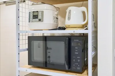 a microwave and a toaster on a shelf at N 5min to waseda sta designer condo high security free wifi in Tokyo