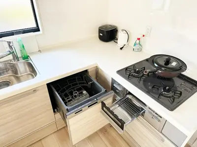 a kitchen with a stove and a sink at Beauty House in Tokyo