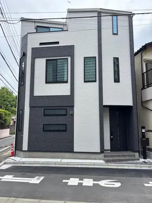 a building with a door on the side of a street at Beauty House in Tokyo