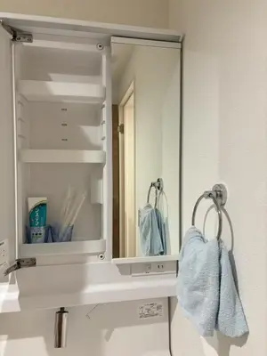 a bathroom with a mirror and a sink at Beauty House in Tokyo
