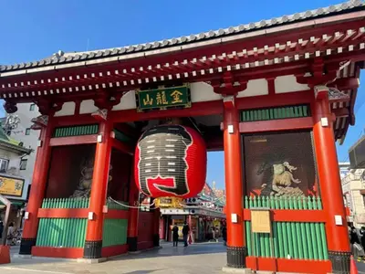 a red building with a red lantern in front of it at Minato Residence-Tokyo Tower-Daimon in Tokyo