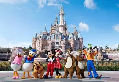 a group of mascots in front of the disney castle at Minato Residence-Tokyo Tower-Daimon in Tokyo