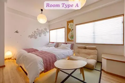 a bedroom with a bed and a chair and a couch at Sakura Hotel Koiwa in Tokyo