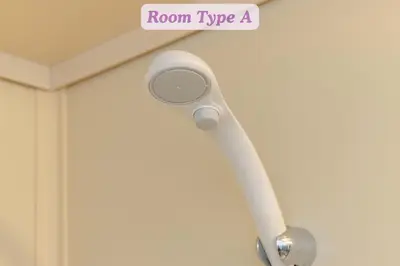 a white room typeaucet hanging on a wall at Sakura Hotel Koiwa in Tokyo