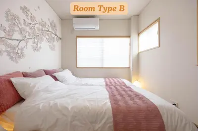 a bedroom with a bed with a room typeb sign on the wall at Sakura Hotel Koiwa in Tokyo