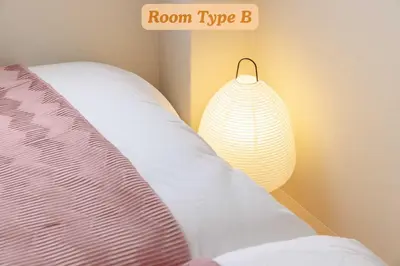 a bedroom with a bed with a room typeb sign at Sakura Hotel Koiwa in Tokyo
