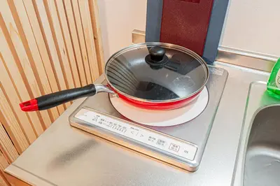 a pot sitting on top of a stove at 2 min walking distance to station cozy room in central tokyo in Tokyo