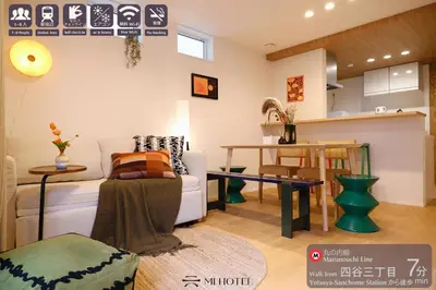 a living room with a couch and a table at Mi-Villa Aprire Yotsuya in Tokyo
