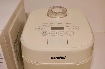 a white coffee maker sitting next to a box at Mi-Villa Aprire Yotsuya in Tokyo