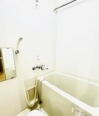 a bathroom with a bath tub and a toilet at \u9326\u7cf8\u753a-502 in Tokyo