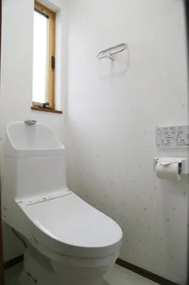a white bathroom with a toilet and a window at Km102\u4e0a\u6c60\u888b in Tokyo