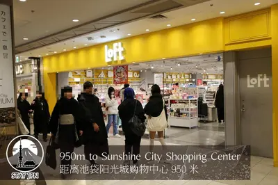 a group of people walking through a shopping center at Km201\u4e0a\u6c60\u888b in Tokyo