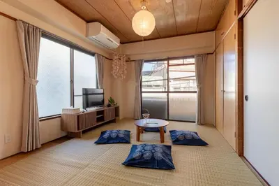 a living room with a table and a tv at o\u30d3\u30eb301 in Tokyo