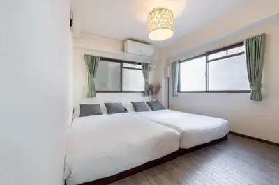 a bedroom with a white bed and a window at o\u30d3\u30eb301 in Tokyo