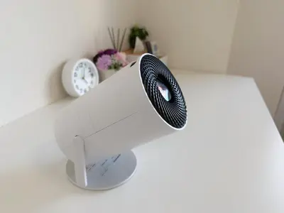 a white sewing machine on a white counter with a clock at \u9326\u7cf8\u753a-601 in Tokyo