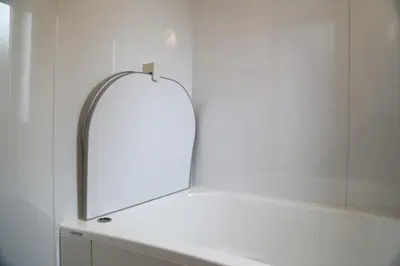 a mirror sitting on top of a white counter at Km202\u4e0a\u6c60\u888b in Tokyo