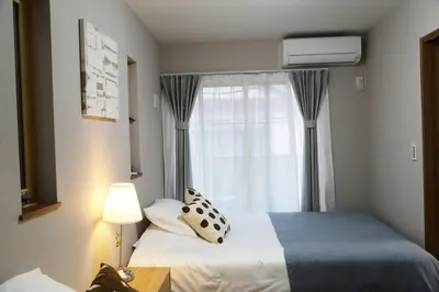 a hotel room with a bed and a window at Km202\u4e0a\u6c60\u888b in Tokyo