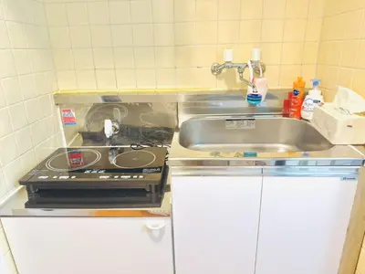 a small kitchen with a sink and a stove at SkyTree-402 in Tokyo