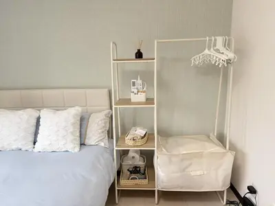 a bedroom with a white bed and a chair at SkyTree-402 in Tokyo