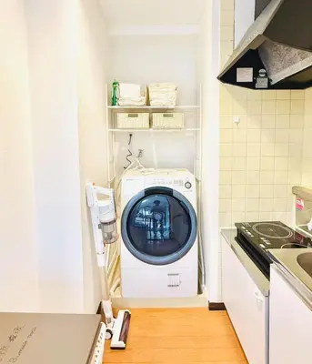 a washer and dryer in a small kitchen at SkyTree-402 in Tokyo