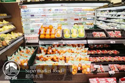 a supermarket filled with lots of fresh fruits and vegetables at Km301\u4e0a\u6c60\u888b in Tokyo