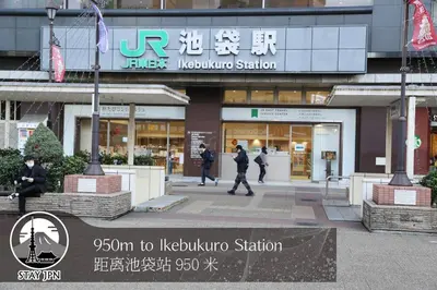 a building with people walking in front of it at Km302\u4e0a\u6c60\u888b in Tokyo